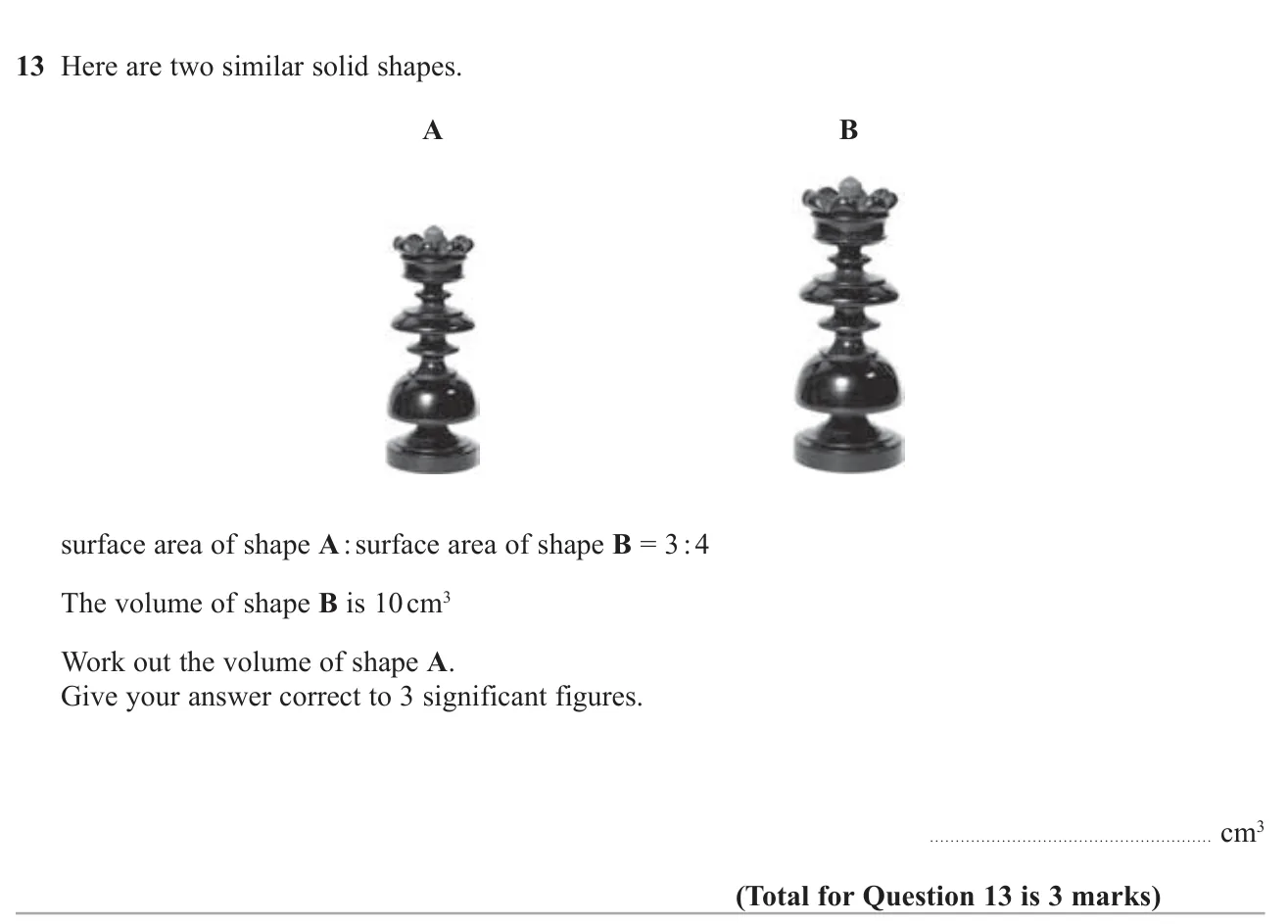 Use a surface-area ratio of similar solids to find the length and volume scale factors, then a missing volume.